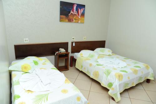 A bed or beds in a room at Hotel Paranoá