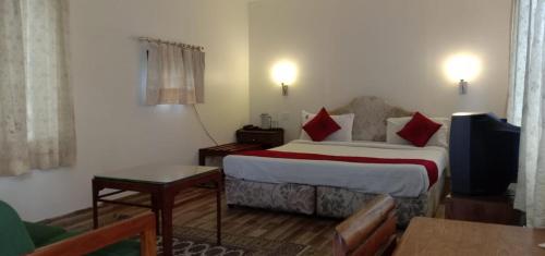 En eller flere senger på et rom på Hotel Le Castle Phase1