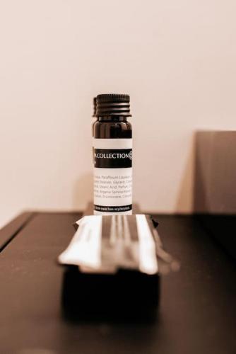 a bottle of sauce sitting on top of a table at Vakantiewoning Domein Hooverbosch in Zonnebeke