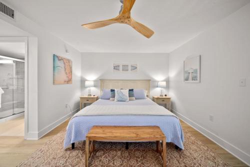 a bedroom with a large bed with a wooden ceiling at Loggerhead Cay #401 in Sanibel