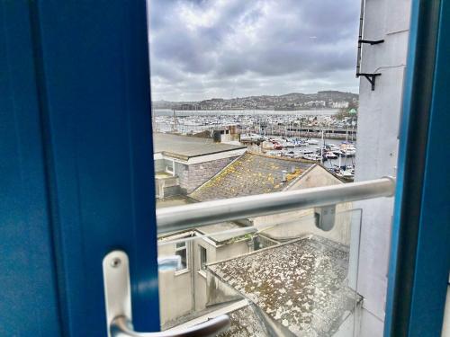 a view of a harbor from a window on a train at Harbour view, Central location in Torquay