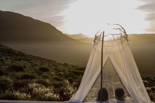 a group of people standing in front of a wedding tent at Simbavati Cederberg Ridge in Clanwilliam