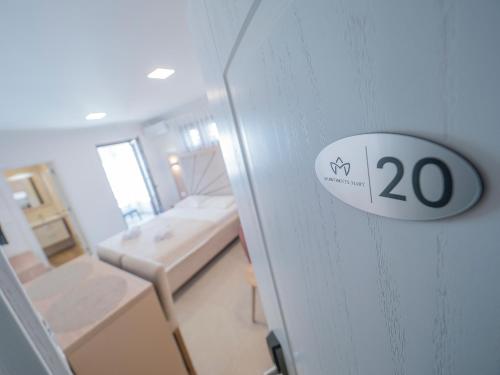 a room with a door with a sign on it at Apartments Mary in Budva
