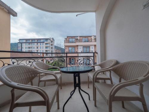 a table and chairs on a balcony with a view at Apartments Mary in Budva