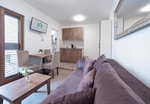 a living room with a couch and a table at Apartments Mary in Budva