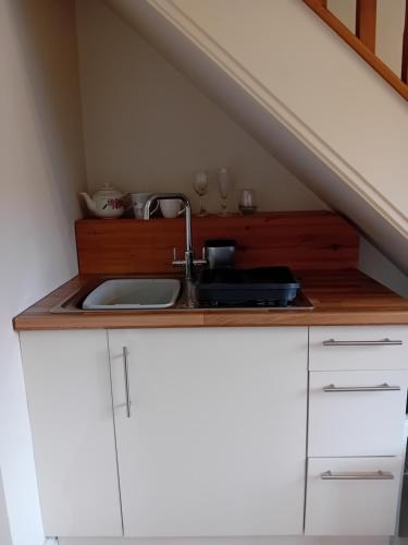 a kitchen with a sink and a counter top at Castle Court in York