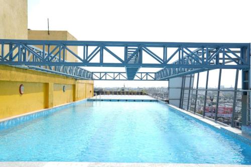 a large swimming pool on top of a building at Regenta Central Hotel & Convention Centre Nagpur in Nagpur
