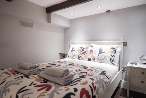 a bedroom with a bed with towels on it at GuestReady - Charming Retreat in Antibes in Antibes