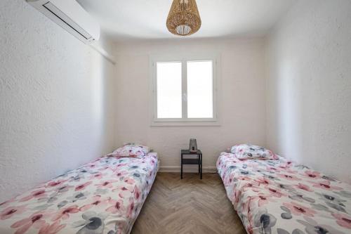 Giường trong phòng chung tại Appartement T3 climatisé centre ville Pérols