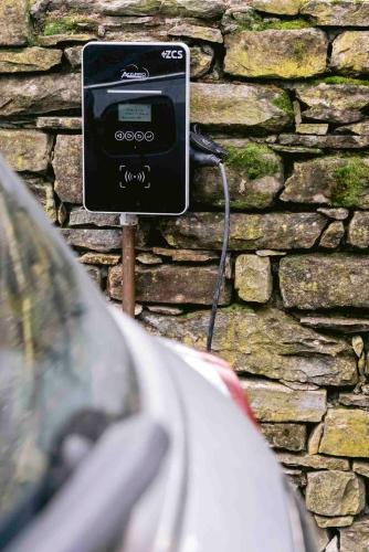 a car is hooked up to a stone wall at Tenuta Moncarlino in Morsasco
