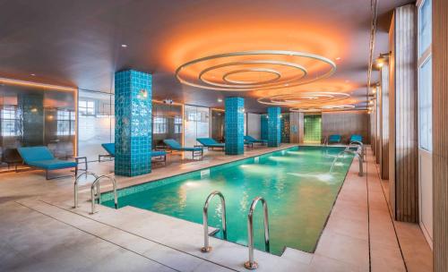 a swimming pool in a hotel with a ceiling at Canfranc Estación, a Royal Hideaway Hotel - Gran Lujo in Canfranc-Estación