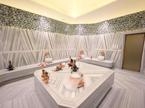 a room with many figurines on a wall at Swissotel Uludag Bursa in Bursa