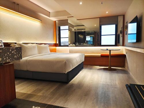 a hotel room with a bed and a bathroom at Bintang Collectionz Hotel in Kuala Lumpur