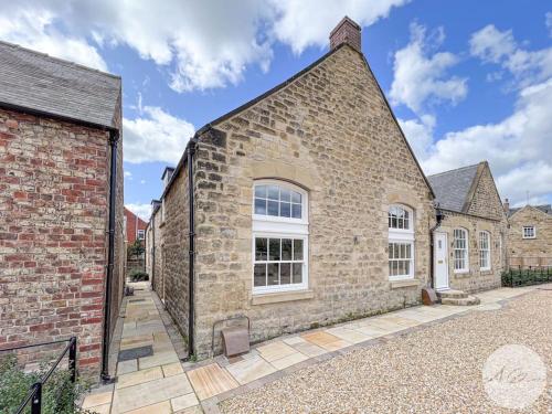 an exterior view of a brick building at Exceptional Holiday Home 5 with Hot Tub Pickering in Pickering