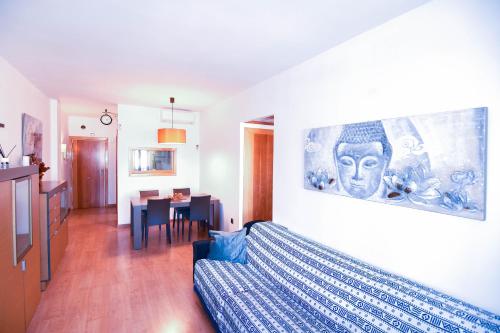 a living room with a bed and a dining room at Touch the sky BCN in Hospitalet de Llobregat