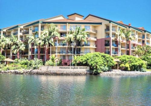 a hotel on the shore of a body of water at Paradise Island Resort & Gardens - Gold Coast Surfers Paradise in Gold Coast