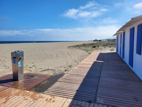 a building on the beach next to a sandy beach at Al Andalus Thalassa in Vera, Almeria in Vera