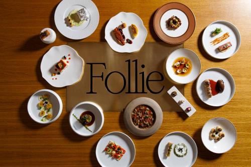 a group of plates of food on a table at Villa Agrippina Gran Meliá – The Leading Hotels of the World in Rome