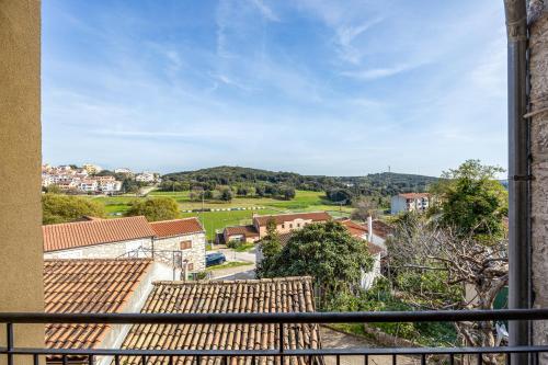 a view from a balcony of a town with houses at Villa Vrsar in Vrsar