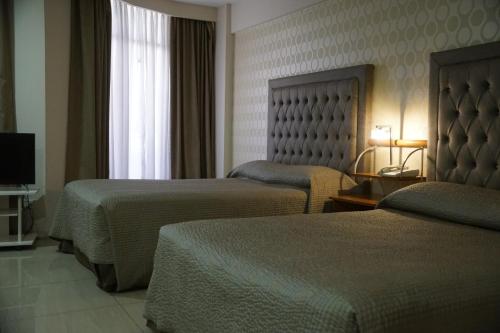 Katil atau katil-katil dalam bilik di Hotel Howard Johnson Rosario