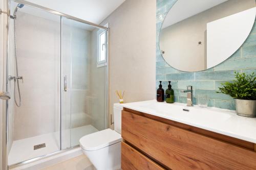 a bathroom with a shower and a toilet and a sink at Lodging Apartments Barceloneta Beach Studio 31 in Barcelona
