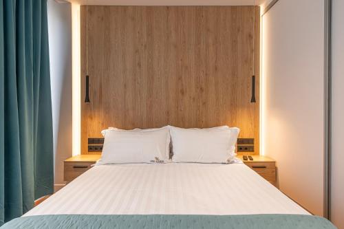 a bedroom with a large bed with two white pillows at A&N Athens Luxury Apartments - Acropolis in Athens