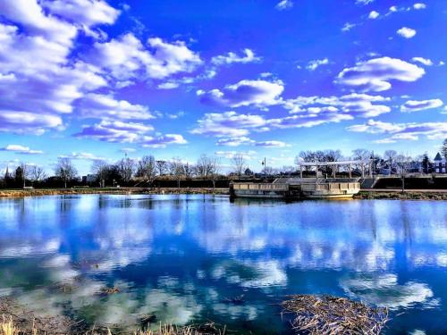 a large body of water with a blue sky and clouds at The loft at Park Place - 3rd floor walk up King and Queen beds fast WIFI and free coffee in Wilmington