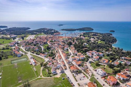 an aerial view of a town next to the ocean at Villa Vrsar in Vrsar