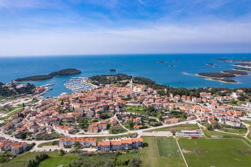 an aerial view of a town next to the ocean at Villa Vrsar in Vrsar