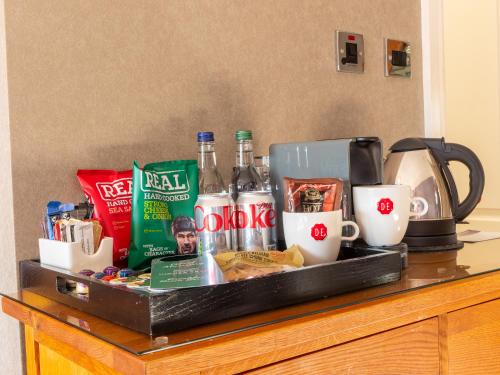 a tray of food and drinks on top of a counter at Widnes Halton Everglades Park Hotel in Widnes