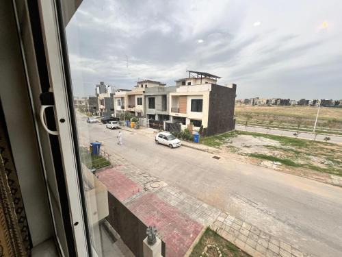 a view from a window of a street with buildings at Deal of the Month Vacation Home in Rawalpindi