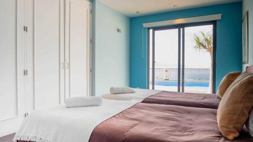 Ένα ή περισσότερα κρεβάτια σε δωμάτιο στο Zula House - Stunning villa spectacular location