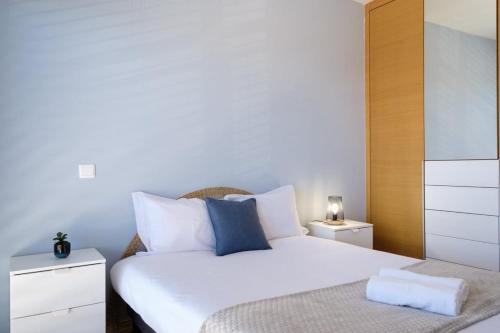 Postel nebo postele na pokoji v ubytování GuestReady - Charming Caniço Retreat