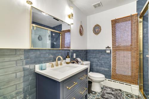 a bathroom with a sink and a toilet at Outdoor Oasis Cresco Family Home with Hot Tub in Cresco