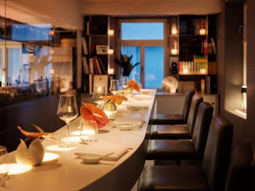 a long table in a restaurant with wine glasses at Bachofer in Waiblingen