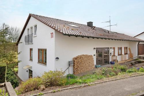 a white house on the side of a road at Lautertal Loft in Blaustein