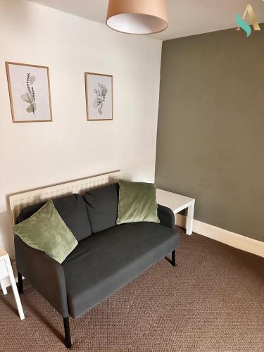 a living room with a couch in a room at Milton Road Flat 3 TSAC in Hartlepool