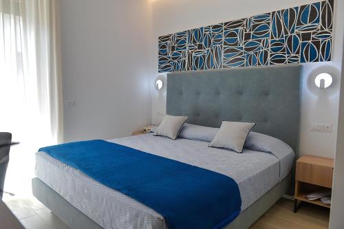 Ένα ή περισσότερα κρεβάτια σε δωμάτιο στο Charming Rooms Amalfi Coast