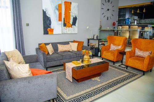 a living room with couches and chairs and a coffee table at Casablanca in Kigali in Kigali