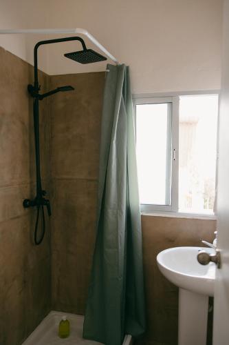 a bathroom with a shower and a sink at Hostal Africa in Tarifa