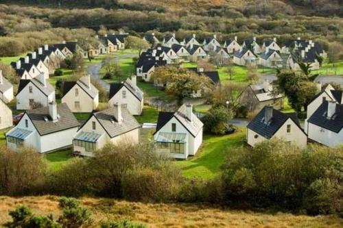 an aerial view of a village with houses at Clifden Glen Cottage in Clifden
