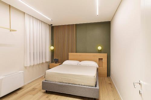 a bedroom with a bed in a room at Giardino Delle Oche - Ocone Taburno Wine County in Ponte