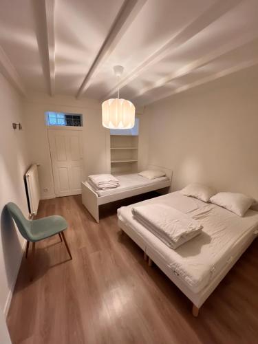 Posteľ alebo postele v izbe v ubytovaní Appartement RDC 9 personnes, 2 chambres, wifi, proche du centre
