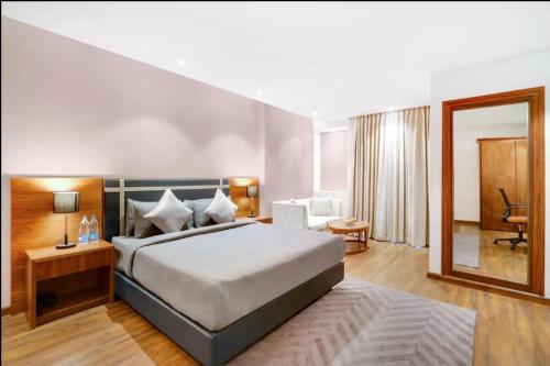 a bedroom with a large bed in a room at Exotic studio in Ghaziabad