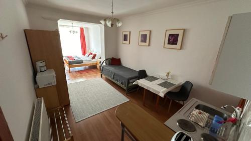 an overhead view of a living room with a couch and a table at Apartman Danka in Bük