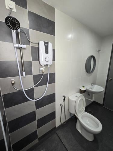 a bathroom with a shower and a toilet and a sink at Manhattan Condomium Water Park Land @ Ipoh in Ipoh