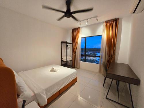 a bedroom with a bed and a ceiling fan at Manhattan Condomium Water Park Land @ Ipoh in Ipoh