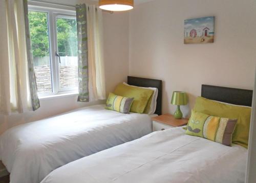 A bed or beds in a room at Golden Cross Lodges 