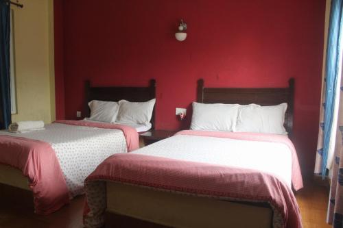 Cama o camas de una habitación en Hotel Holidays Inn - Bagpacker's Home