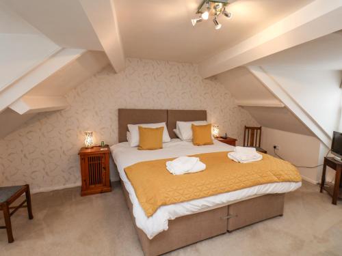 Postelja oz. postelje v sobi nastanitve Bluebell Cottage